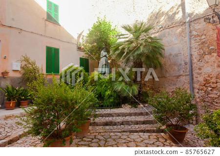 Beautiful street in Valldemossa, famous old mediterranean village of Majorca Spain. Beautiful street in Valldemossa, famous old mediterranean village of Majorca Spain. 85765627