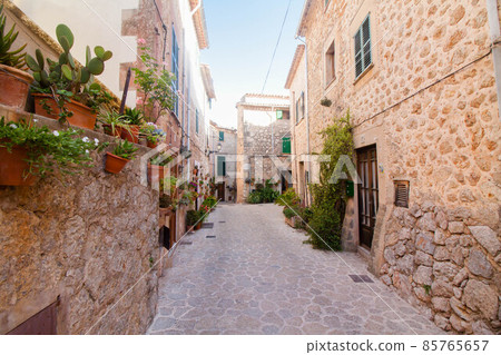 Beautiful street in Valldemossa, famous old mediterranean village of Majorca Spain. Beautiful street in Valldemossa, famous old mediterranean village of Majorca Spain. 85765657