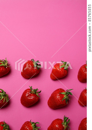 Fresh tasty strawberry with leaves on pink background 85765855