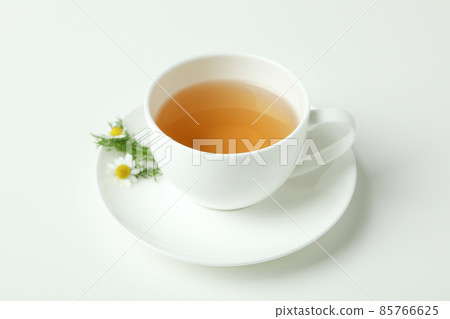 Cup of chamomile tea on white background 85766625