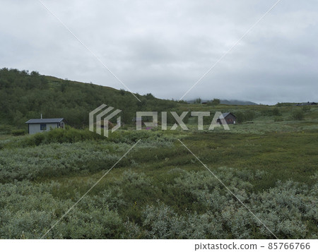 Sami village Staloluokta at Virihaure lake with houses and cottage, mountains and birch trees. summer moody and foggy day at Padjelantaleden hiking trail. Sweden Lapland landscape Sami village Staloluokta at Virihaure lake with houses and cottage, mountains and birch trees. summer moody and foggy day at Padjelantaleden hiking trail. Sweden Lapland landscape 85766766