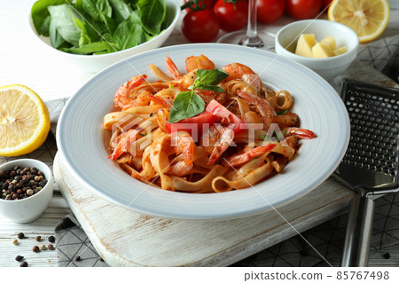 Concept of cooking shrimp pasta on white wooden table 85767498