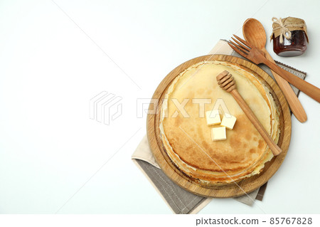 Concept of tasty food with crepes on white background Concept of tasty food with crepes on white background 85767828
