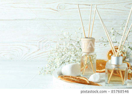 Aromatic concept with diffusers on white wooden table 85768546