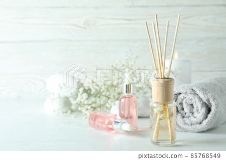 Aromatic concept with diffuser on white wooden table Aromatic concept with diffuser on white wooden table 85768549