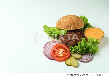 Concept of cooking burger on white background Concept of cooking burger on white background 85768609