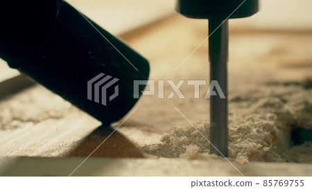 Router bit cutting wood and vacuum cleaner collecting dust, close-up slow motion shot Router bit cutting wood and vacuum cleaner collecting dust, close-up slow motion shot 85769755