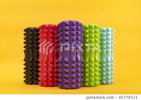 Multicolored rollers for massage. MFR roller relax. Fitness Equipment for self-massage. Front view 85770521