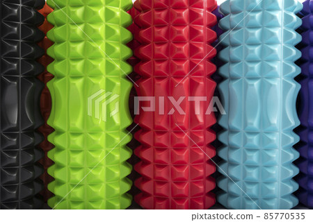Close-up multicolored massage rollers for body massage. Foam myofascial rollers for physiotherapy. Top view 85770535