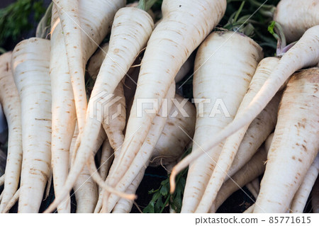 Raw fresh organic parsley roots on the market 85771615