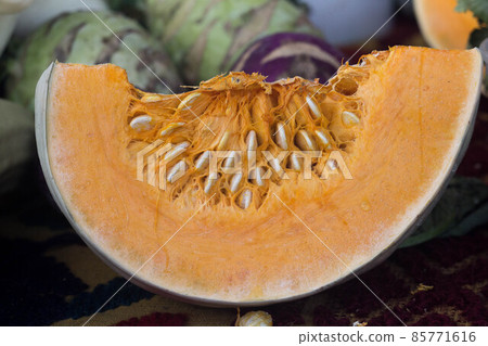 Slice of fresh raw organic pumpkin on a market 85771616
