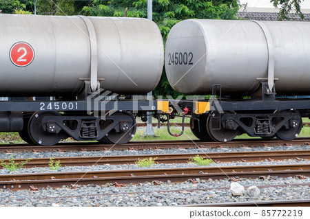 The bogie of the oil tanker in the freight train is parked in the railway yard. The bogie of the oil tanker in the freight train is parked in the railway yard. 85772219