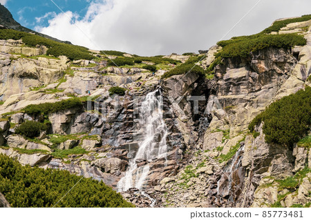 Amazing view of the waterfall in Tatra mountains in Slovakia.  85773481