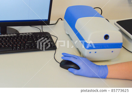 Chemist team working together at desk using computer in the laboratory Chemist team working together at desk using computer in the laboratory 85773625