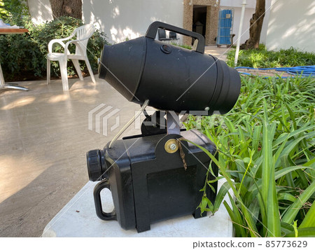 electric sprayer on background. It can be used for disinfection of rooms, living rooms, vehicles. Coronavirus Control electric sprayer on background. It can be used for disinfection of rooms, living rooms, vehicles. Coronavirus Control 85773629