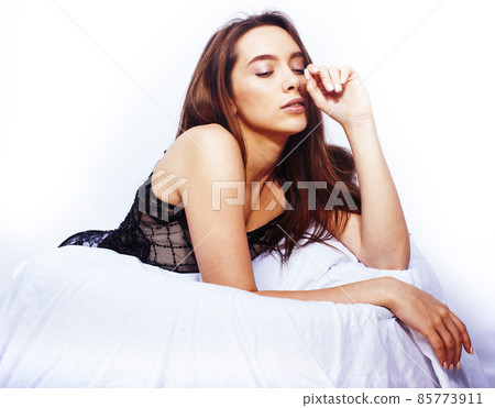 young pretty happy smiling sexy woman in her bed bedroom, lifestyle people concept young pretty happy smiling sexy woman in her bed bedroom, lifestyle people concept 85773911