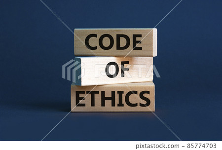 Code of ethics symbol. Concept words 'Code of ethics' on wooden blocks on a beautiful grey background. Business and code of ethics concept. Copy space. Code of ethics symbol. Concept words 'Code of ethics' on wooden blocks on a beautiful grey background. Business and code of ethics concept. Copy space. 85774703