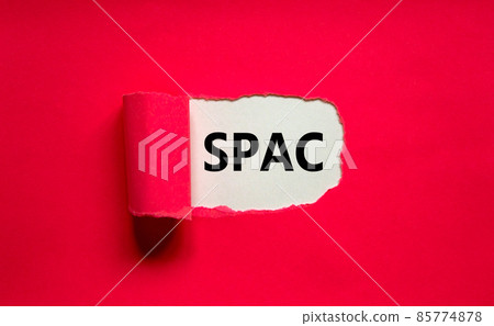 SPAC, special purpose acquisition company symbol. Words 'SPAC, special purpose acquisition company behind torn purple paper on purple background, copy space. Business and SPAC concept. 85774878