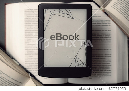 Readers. Digital e book, library reader tablet with books on dark background. Ebook, e learning electronic internet mobility concept. 85774953