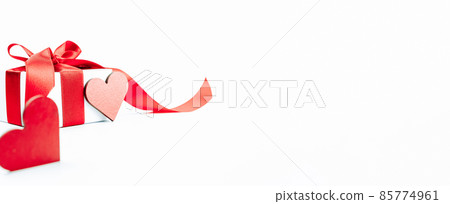 Valentine greeting card. Red heart, romantic gift with red ribbon on love white background. Valentines day decoration card with copy space. 85774961
