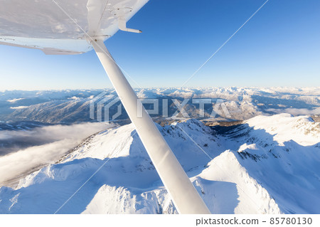 Aerial View flying from a small airplane over the mountain landscape 85780130