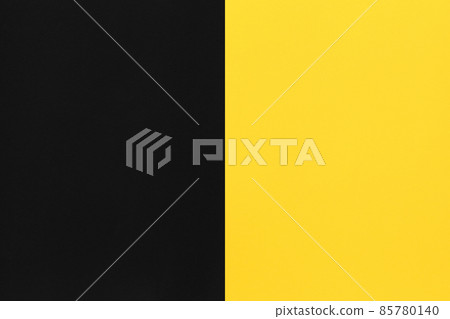 Black and yellow paper stacked on top of art background. 85780140