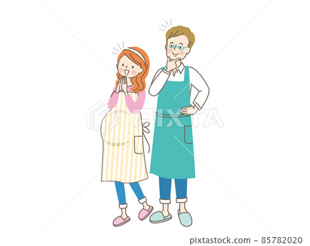 Pregnant smiling woman and husband in an apron 85782020