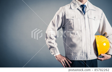 Man studio portrait gray back in work clothes Man studio portrait gray back in work clothes 85782262