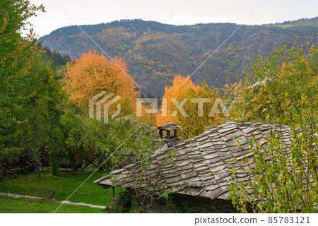 Old traditional Bulgarian house in mountain village of Kovachevitsa. Traditional slan stone roofs Old traditional Bulgarian house in mountain village of Kovachevitsa. Traditional slan stone roofs 85783121