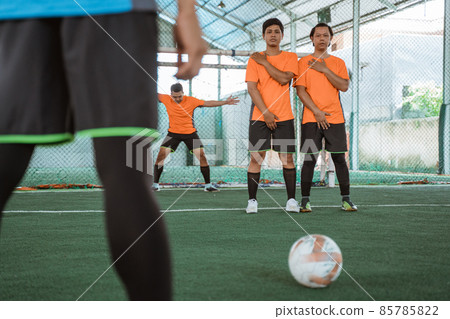 Two futsal players build a posse to block the opponent's 85785822