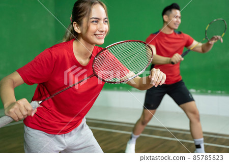 Mixed doubles badminton player with stance position ready to play 85785823