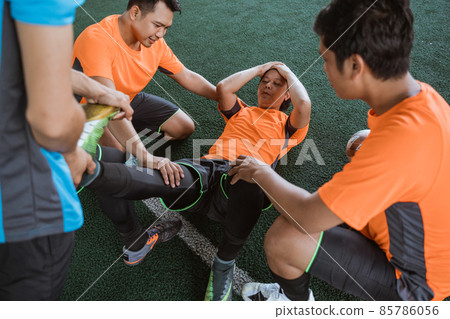 Disappointed player lying on the ground because of an injury 85786056