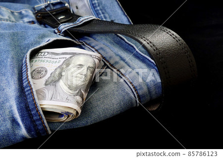 100 usd banknotes visible in the pocket of a jeans lying on the floor, your jeans and 100 usd, 85786123