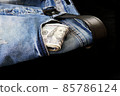 100 usd banknotes visible in the pocket of a jeans lying on the floor, your jeans and 100 usd, 85786124