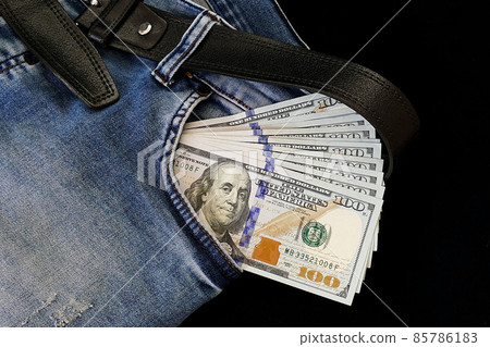 100 usd banknotes visible in the pocket of a jeans lying on the floor, your jeans and 100 usd, 85786183