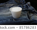 along with blue jeans and a measure of laundry detergent, 85786283