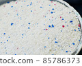 a measure of powdered laundry detergent, close-up laundry detergent, 85786373