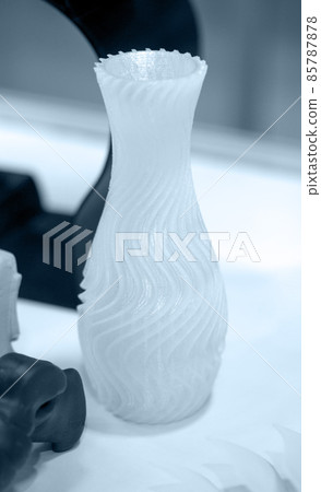 White object 3D printed from plastic close-up. New 3D printing technology. White object 3D printed from plastic close-up. New 3D printing technology. 85787878