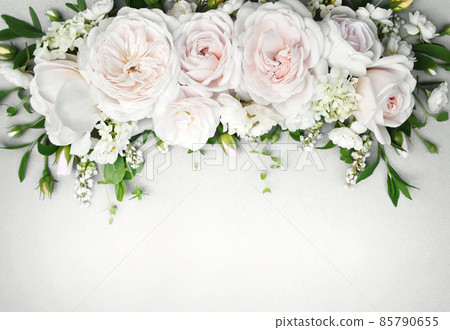 Delicate blooming festive roses and light pink flowers background, blossoming rose flower soft pastel frame, bouquet floral card Delicate blooming festive roses and light pink flowers background, blossoming rose flower soft pastel frame, bouquet floral card 85790655