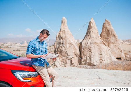 Happy man on summer vacation in famous place. Cave formations. 85792306