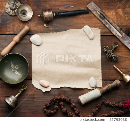 Tibetan singing copper bowl with a wooden clapper , objects for meditation and alternative medicine, top view. Plunging into a trance, copy space Tibetan singing copper bowl with a wooden clapper , objects for meditation and alternative medicine, top view. Plunging into a trance, copy space 85793088