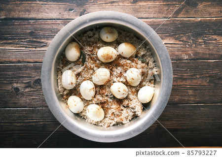 egg, mutton biryani meal in a plate on table. egg, mutton biryani meal in a plate on table. 85793227
