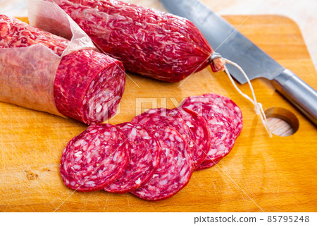 Traditional spanish salchichon sausage on wooden table 85795248