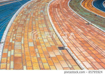 Beautiful whimsical colorful pavement tile blocks in Italy 85795924