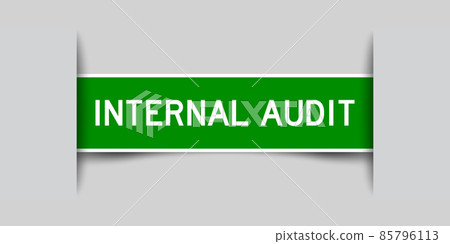 Inserted green color label sticker with word internal audit on gray background 85796113