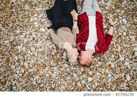 happy couple on a beach happy couple on a beach 85799239