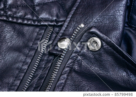 Zipper and rivets on black leather clothes 85799498
