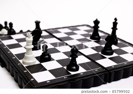 Captured king of chess on white background Captured king of chess on white background 85799502
