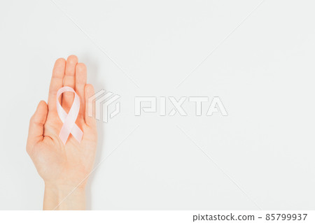 World Cancer Day ribbon symbol in woman hand 85799937