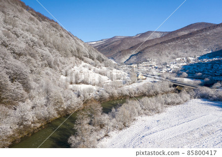 Winter holidays adventure. Cars on winter road aerial wiew Winter holidays adventure. Cars on winter road aerial wiew 85800417